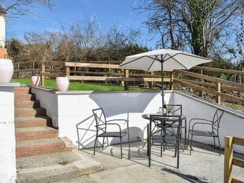 Paved patio area with furniture | Delfryn, Llanarth, near New Quay