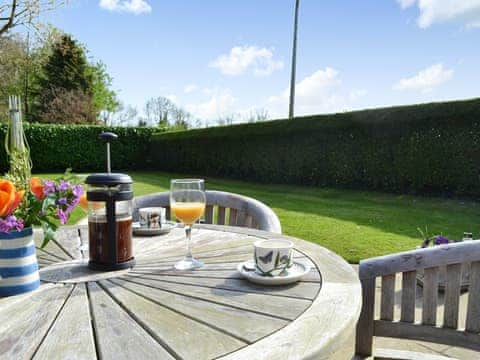 Outdoor seating area on the patio | Poplar Bungalow, Lyng, near Norwich