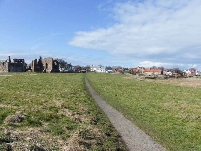 Photo showing the property&rsquo;s proximity to the ruined priory on Holy Island | The Old Granary, Holy Island, near Berwick-upon-Tweed