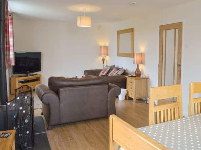 Charming living room with wood burner | The Old Parish Hall, Seahouses, near Alnwick