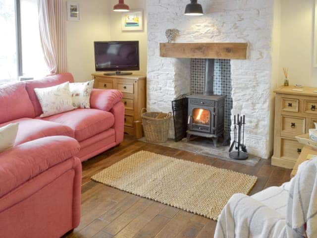 Welcoming living room with wood burner | Honeysuckle Bay Cottage, Brixham