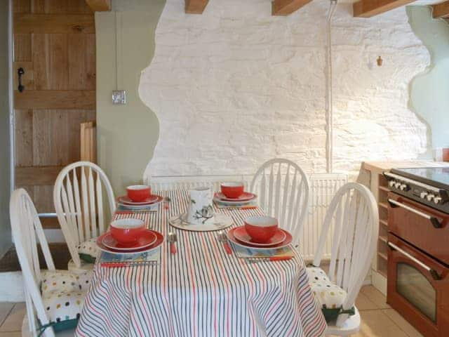 Convenient dining area within kitchen | Honeysuckle Bay Cottage, Brixham