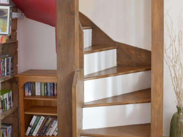 Narrow spiral staircase to upper floor | Honeysuckle Bay Cottage, Brixham