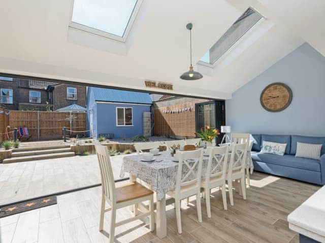 Impressive dining area with bi-fold doors leading to garden | Ascot Villa, Sheringham