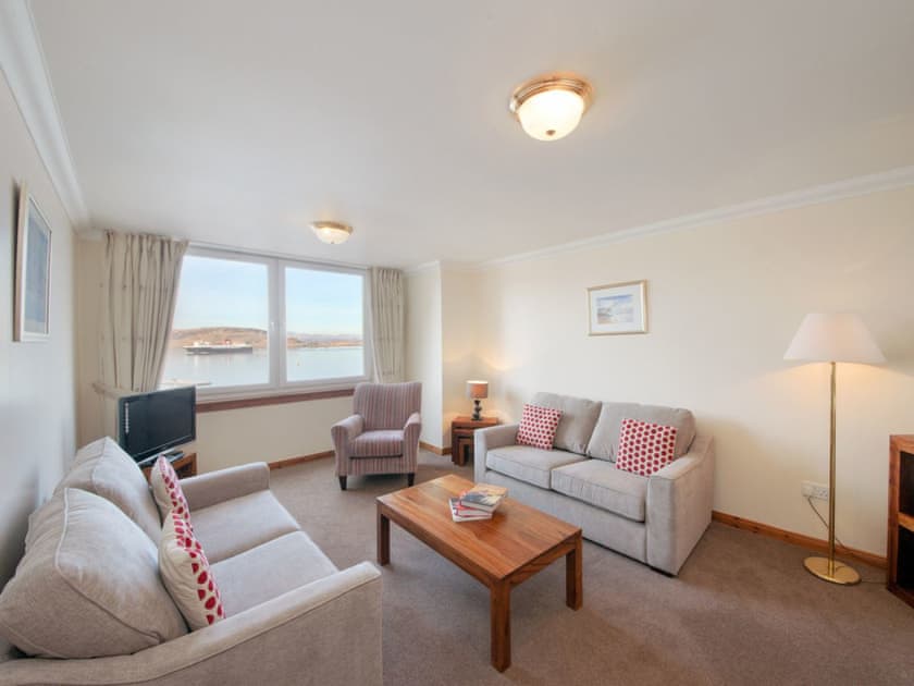 Comfortable living room with fantastic bay views | Esplanade Court, Oban, Argy