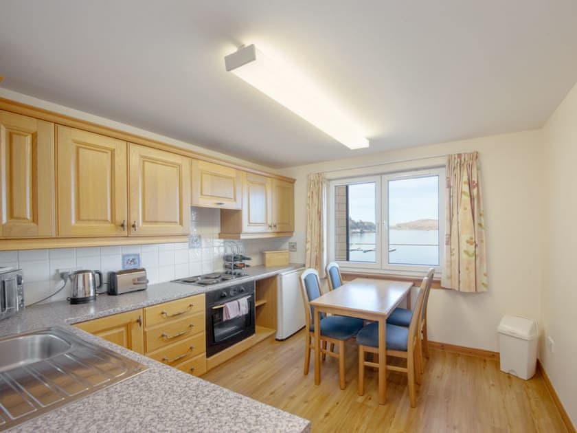 Well equipped kitchen with views out over the bay | Esplanade Court, Oban, Argy