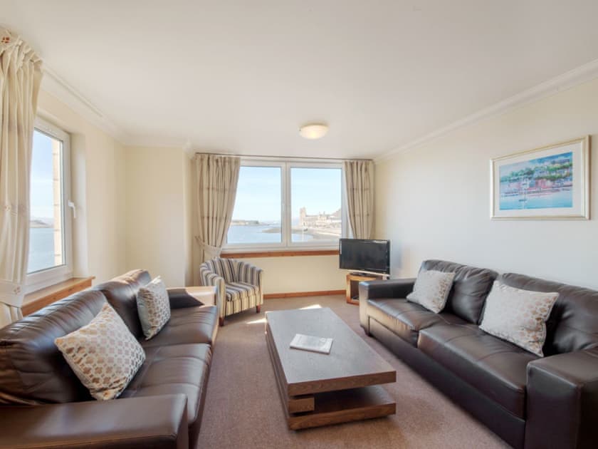 Comfortable living area with far reaching views over the bay | Apartment, Tiree 4, Tiree 3 - Esplanade Court, Oban, Argyll