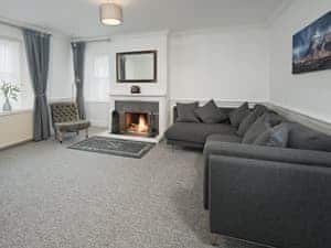 Tastefully furnished living room with wood burner | Callander&rsquo;s, Gatehouse of Fleet