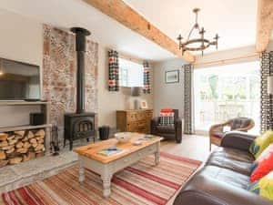 Welcoming living area with wood burning fire | The Barn - Oak Tree Farm, West Witton, near Leyburn