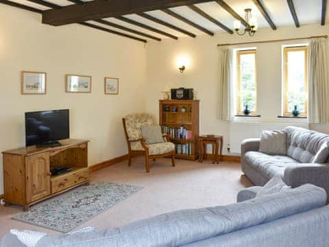 Welcoming living room | Sawmill Cottage - The Old Timberyard, Puncknowle, near Dorchester