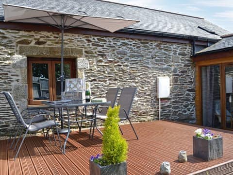 Inviting decking with relaxing sitting-out-area | Blackthorn Cottage, Swan Pool, near Falmouth