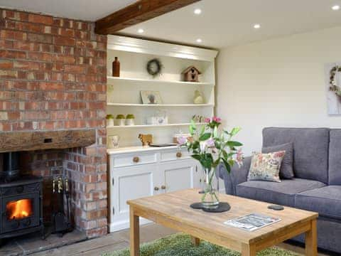 Charming living room with cosy wood burner | Highfield Barn, Nawton, near Helmsley