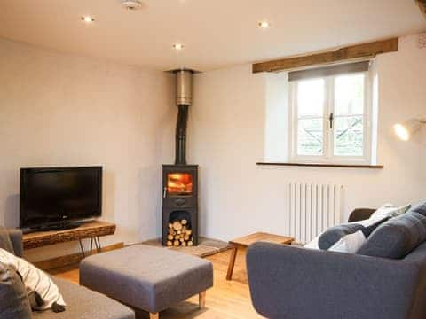 Living room with wood burner | The Cider Barn at Emmings Farm, Elton, Newnham-on-Severn