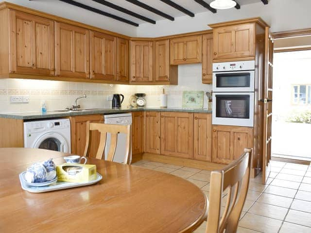 Well-equipped kitchen with dining area | Sawmill Cottage - The Old Timberyard, Puncknowle, near Dorchester