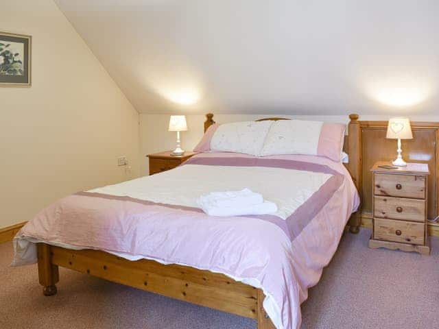 Relaxing double bedroom with en-suite bathroom | Sawmill Cottage - The Old Timberyard, Puncknowle, near Dorchester