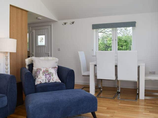 Living room with dining area | Harrys Hut, Brighstone, near Freshwater