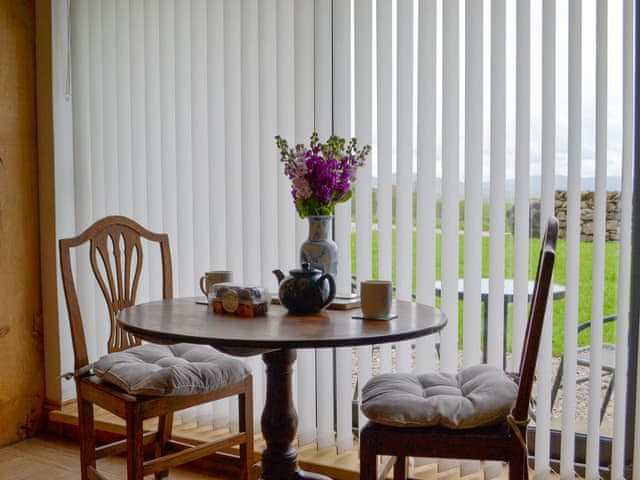 Intimate dining area within living room | The Den - High Thorn Farm Cottages, Selside near Kendal