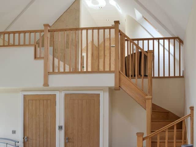 Double bedroom with stairs to the bathroom area | The Farmhouse - Bowlees Holiday Cottages, Wolsingham, near Stanhope