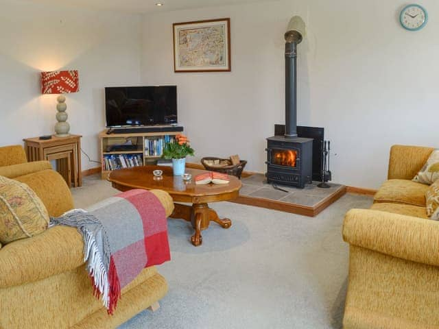 Delightful living area with cosy wood burner | Lilly&rsquo;s, Boyton, near Launceston