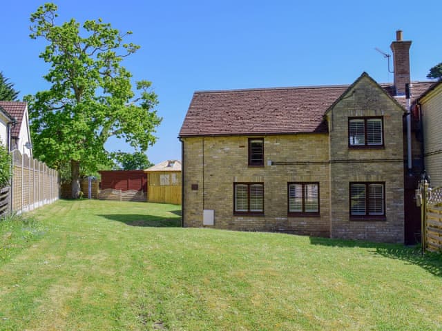 Spacious lawned garden | The Coach House, Wootton, near Ryde