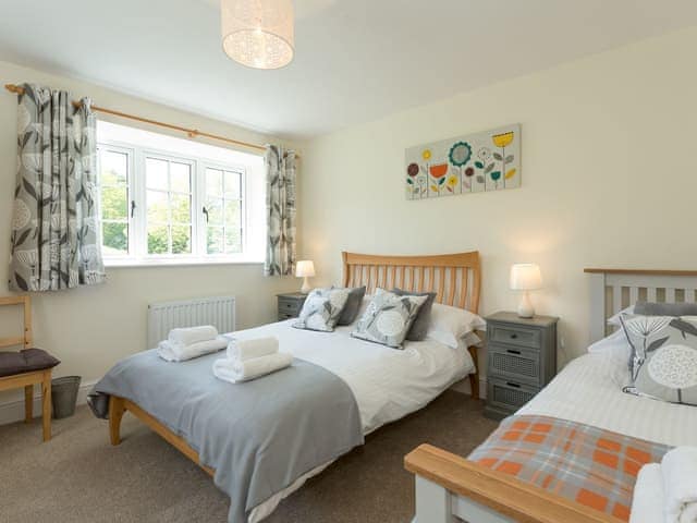 Family bedroom with a double and a single bed | The Barn - Oak Tree Farm, West Witton, near Leyburn