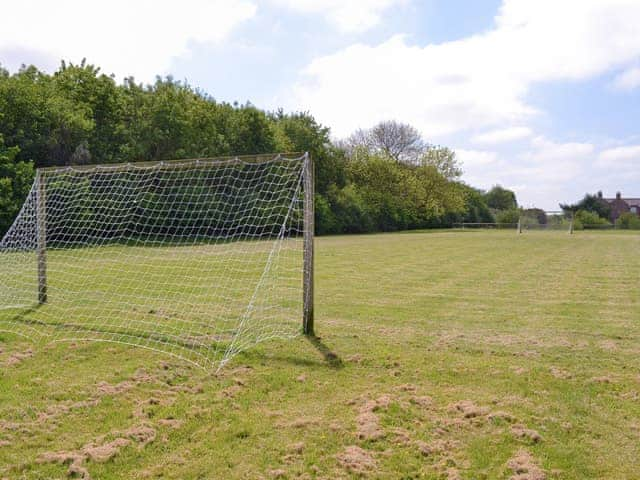 Large football field with goals within the shared grounds | Struncheon Hill Farm, Brandesburton, near Bridlington