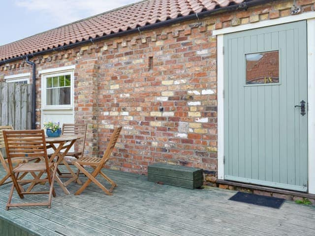 Decked area with outdoor furniture | Woodlands - Struncheon Hill Farm, Brandesburton, near Bridlington