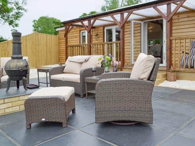 Spacious patio area | Cedar Lodge, Cowbeech, near Hailsham