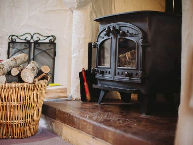 Welcoming wood burning fire in living area | Gelt Cottage, Castle Carrock, near Brampton