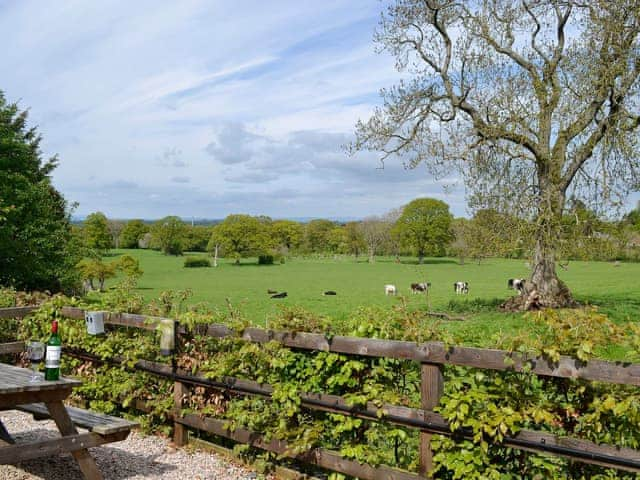 Views over the fields and picnic style seating | Swallow Cottage - Lakerigg, Dalston, near Carlisle