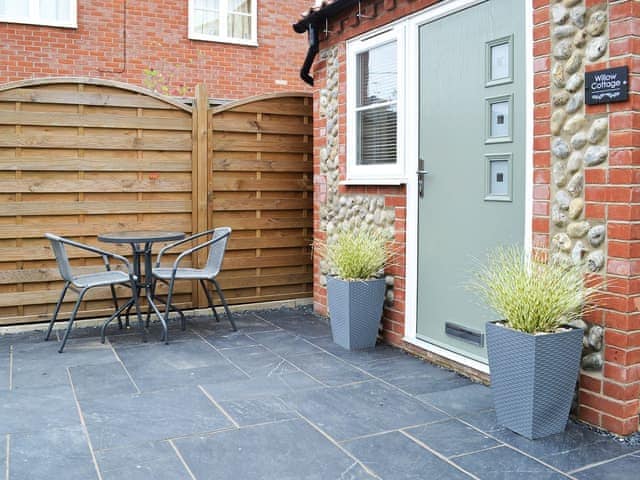 Slate-flagged area with table and chairs | Willow Cottage, Great Ryburgh, near Fakenham