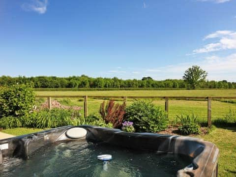 Inviting hot tub with fantastic views | The Barn - Midknowle Farm Cottages, South Barrow, near Yeovil