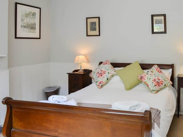 Inviting double bedroom with sleigh bed | Fallodon Burnhouses, near Beadnell