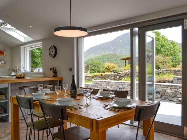 Contemporary open-plan living space with ideally place dining area | The Old Post Office Gillerthwaite, Loweswater, near Cockermouth