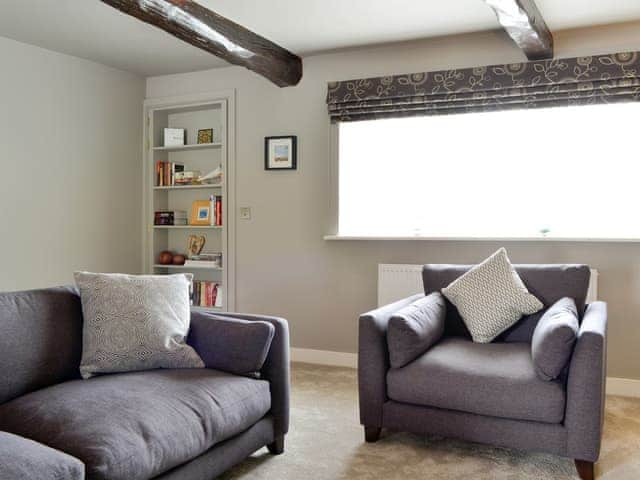 Comfy seating within the sitting room | The Old Post Office Gillerthwaite, Loweswater, near Cockermouth