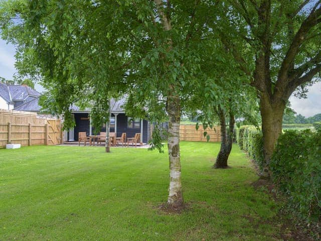 Secluded, lawned garden | Robin Cottage - Higher Tor Cottages, East Ogwell, near Newton Abbot