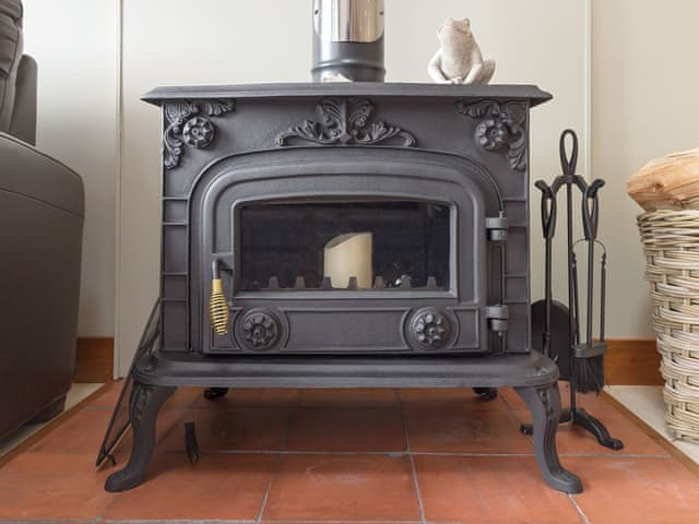 Warming wood burner | Toad Hall Cottage, White Colne, near Colchester