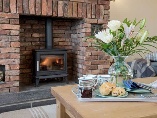 Welcoming living room with wood burner | Seascape - Proctors Stead Cottages, Dunstan, near Craster