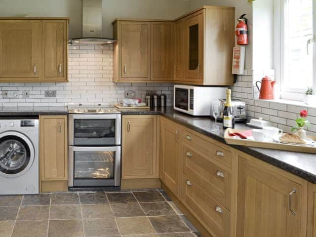 Well-equipped fitted kitchen | Holly Cottage, Pett