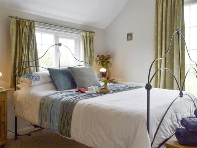 Elegant double bedroom | Holly Cottage, Pett