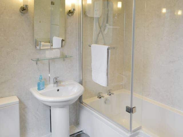 Family bathroom with shower over bath | Oak Cottage - Whitelee Farm, Bryness, near Otterburn