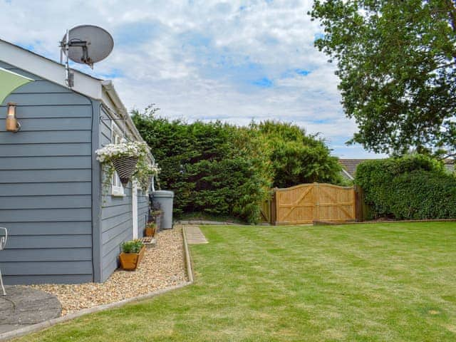 Delightful lawned garden | Harrys Hut, Brighstone, near Freshwater