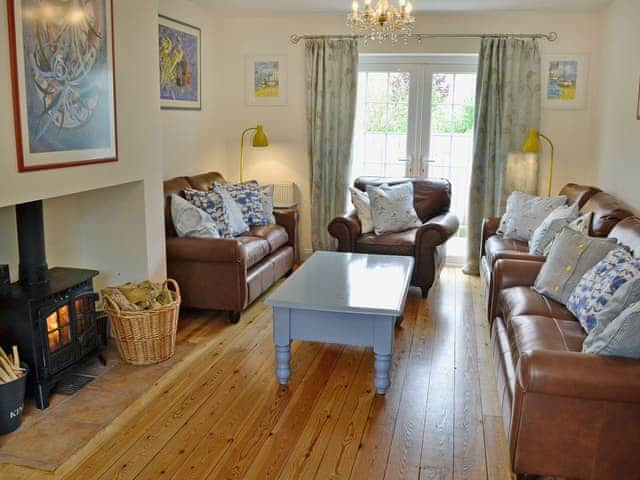 Beautifully decorated living room cosy woodburner | Woodbrook Cottage, Bothenhampton, near Bridport