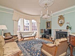 Stylishly furnished living room with open fire | Regents House, Arundel