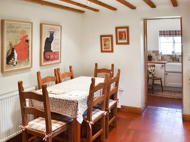 Quaint dining area with beamed ceiling | Woodhouse Cottage, Dobshill, near Chester