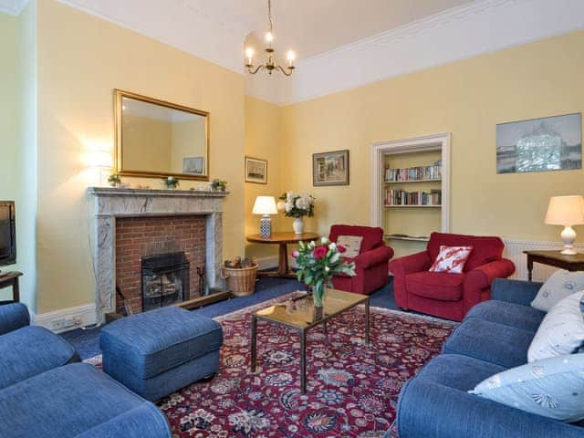 Attractive living room with an open fire | The Old Butlers House, Cley-next-the-Sea