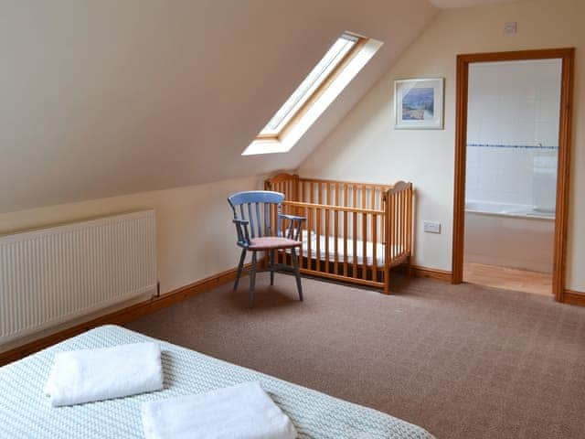 Double bedroom with child&rsquo;s cot | The Stables, Somersal Herbert, near Ashbourne