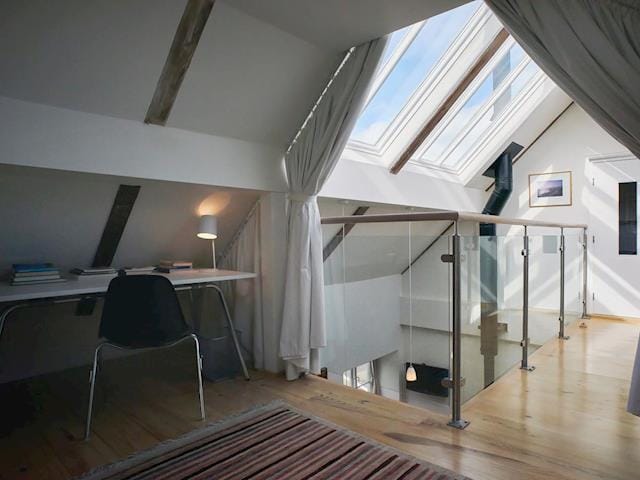 Impressive walkway with glass roof leading to galleried study area | Madeleine&rsquo;s Barn, Wells-next-the-Sea