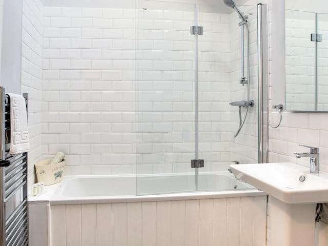 Bathroom with over-bath shower and toilet | Troutbeck Cottage - Scalby Lodge, Scalby, Scarborough