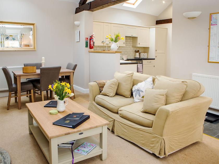 Spacious beamed living/dining room with wood-burning stove | Scalby Lodge Farm - Springthorpe Cottage - Scalby Lodge, Scalby, Scarborough